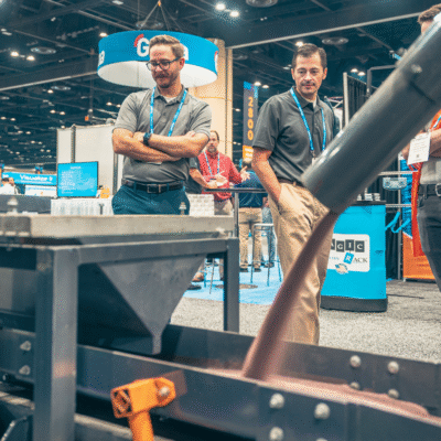 B5200_Attendees Looking at Oscillating Conveyor (2) (1) B5200_Attendees Looking at Oscillating Conveyor (2) (1)