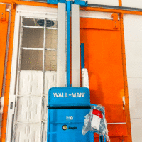 Industrial Wall-Man lifting and positioning system inside a wash and paint booth
