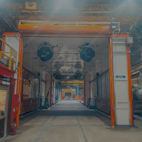 Combination wash and paint booth designed for high-volume industrial manufacturing